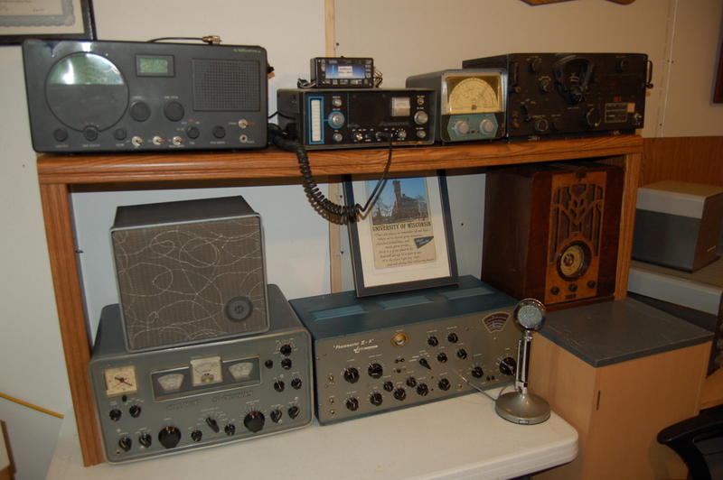 Mike's shack showing Hammarlund HQ170, DX-100, MFJ antenna tuner, Kenwood TS-520. A TV monitor, notebook computer and printer round out the shack.