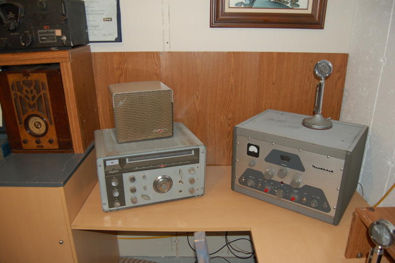 Mike Rome Wisconsin hamshack. Sitting in a corner on the right wall is a computer desk with a Kenwood TS-520, Phasemaster II B, and Ameritron AL-811 with three 572B tubes. On top of the linear is a Heathkit SB610 monitor scope. On top of the Kenwood is its D-104 mic. On top of the phasemaster is a power meter with the phasemaster's D-104.